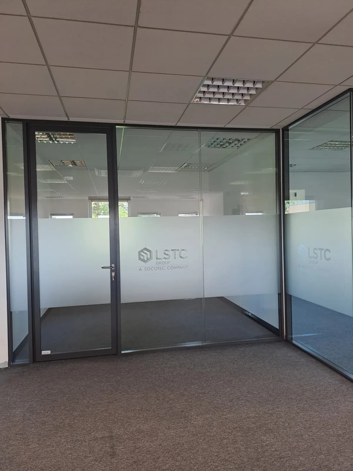 Black-framed glazed meeting room partition at Charlotte House in Derby