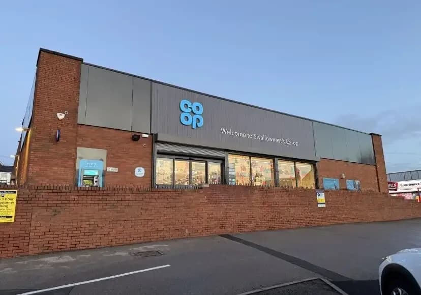 Retail interior at CO-OP Swallownest showing suspended ceiling and shopfit