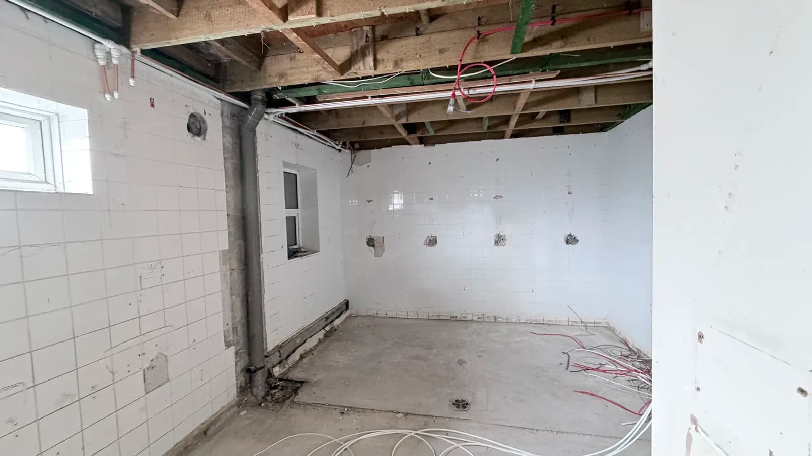 GRP hygienic cladding panels installed floor-to-ceiling in processing hall perimeter at FCC Environment