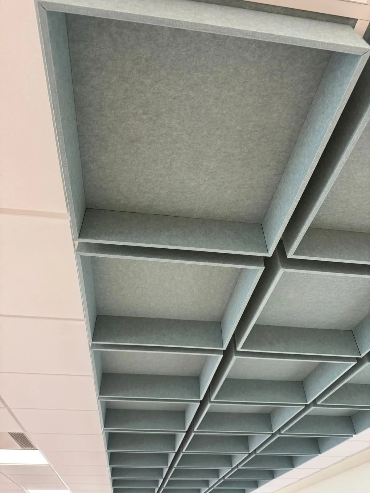Linear hanging acoustic baffles beneath the completed Jubilee Campus suspended ceiling