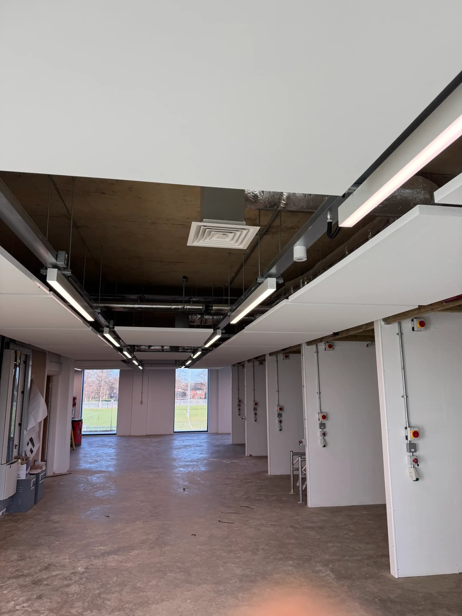 Interior view of Peterborough College showing completed acoustic ceiling system and education fit-out
