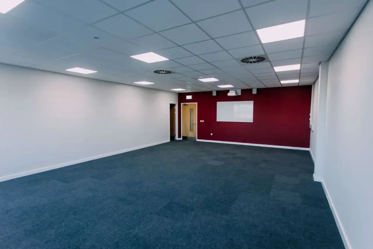 Acoustic wall panels installed in main corridor at Redmoor Academy showing panel layout and colour