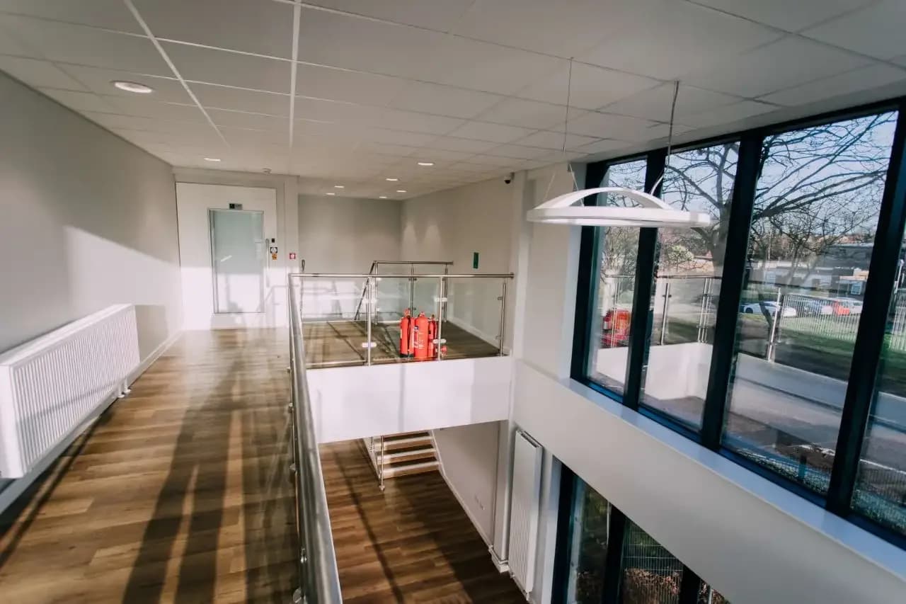 Close-up of acoustic panel installation at Redmoor Academy showing fixing detail and panel alignment