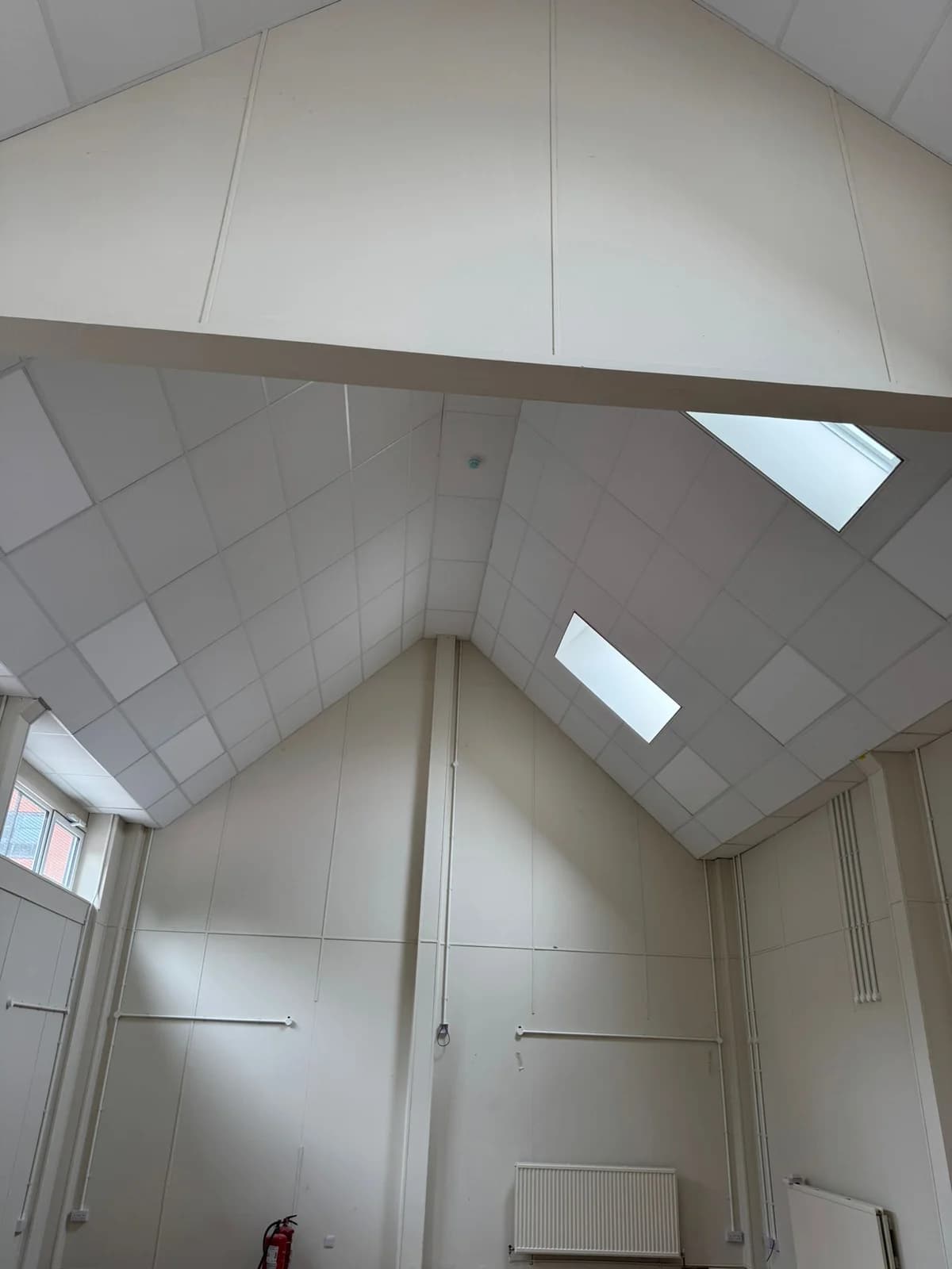 After completion of the white angled suspended ceiling at Seventh-day Adventist Church, Nottingham