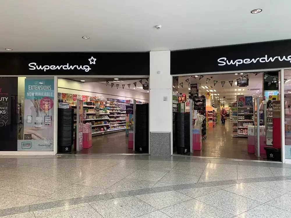 Superdrug Brighton ceiling detail showing suspended grid system and integrated lighting by Eastledge
