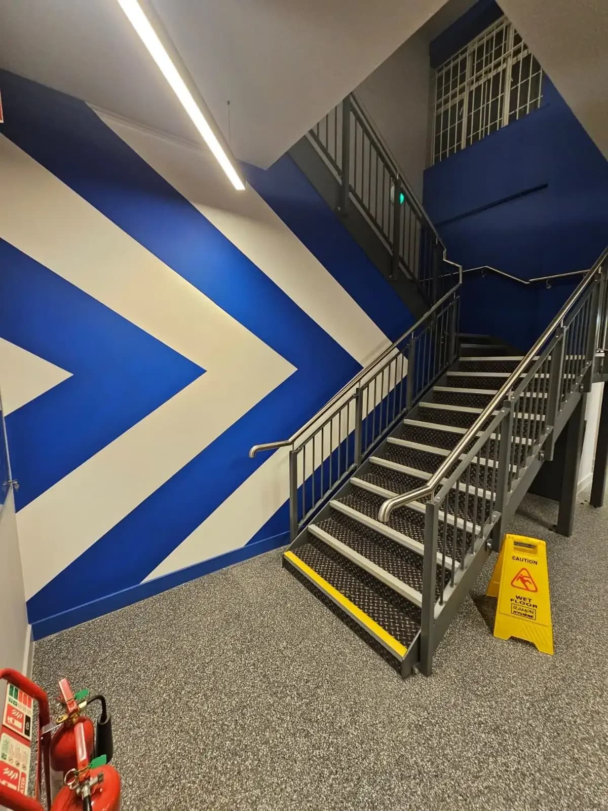 Finished acoustic lining and partition walls at the stairwell installed by Eastledge at The Gym Group Hendon in London.