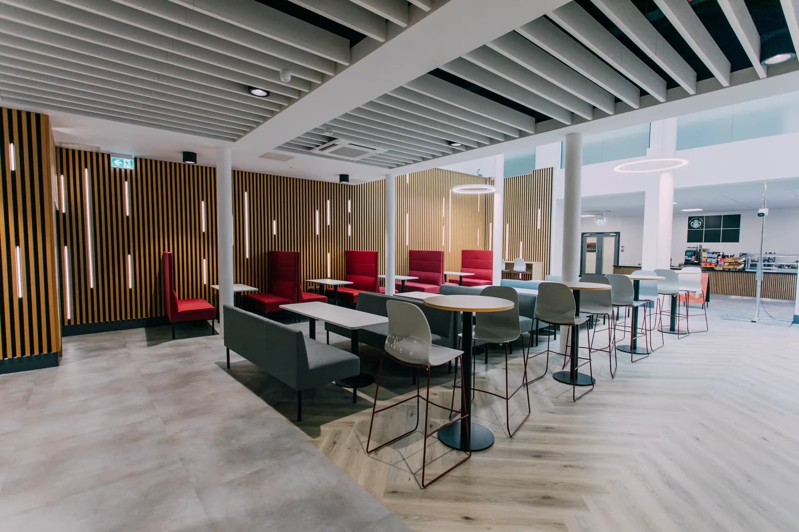 Acoustic ceiling panel installation viewed from above in a commercial interior