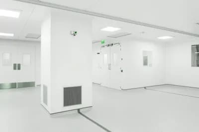 Clean-room clinical corridor showing suspended ceiling and hygienic wall finishes