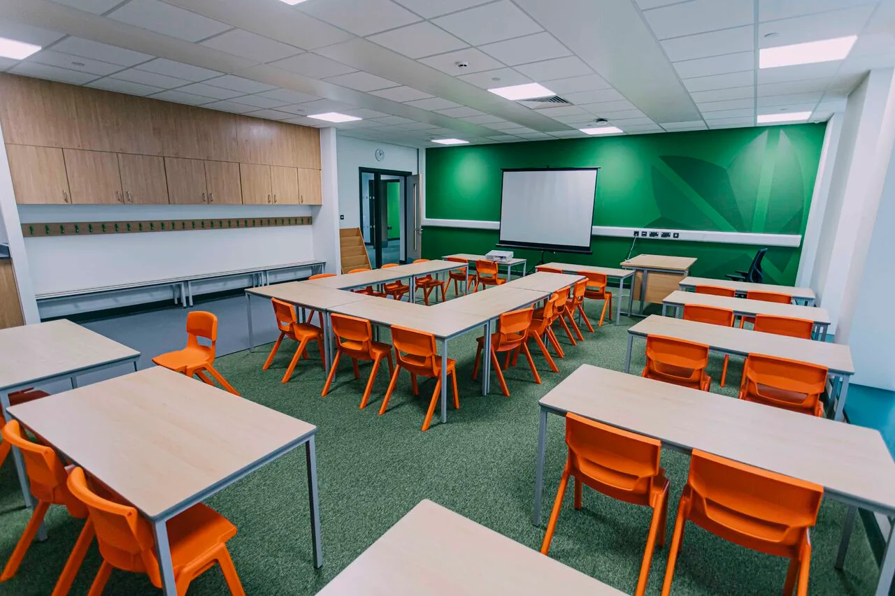 Finished suspended ceiling in a Burleyfield School teaching space with integrated lighting
